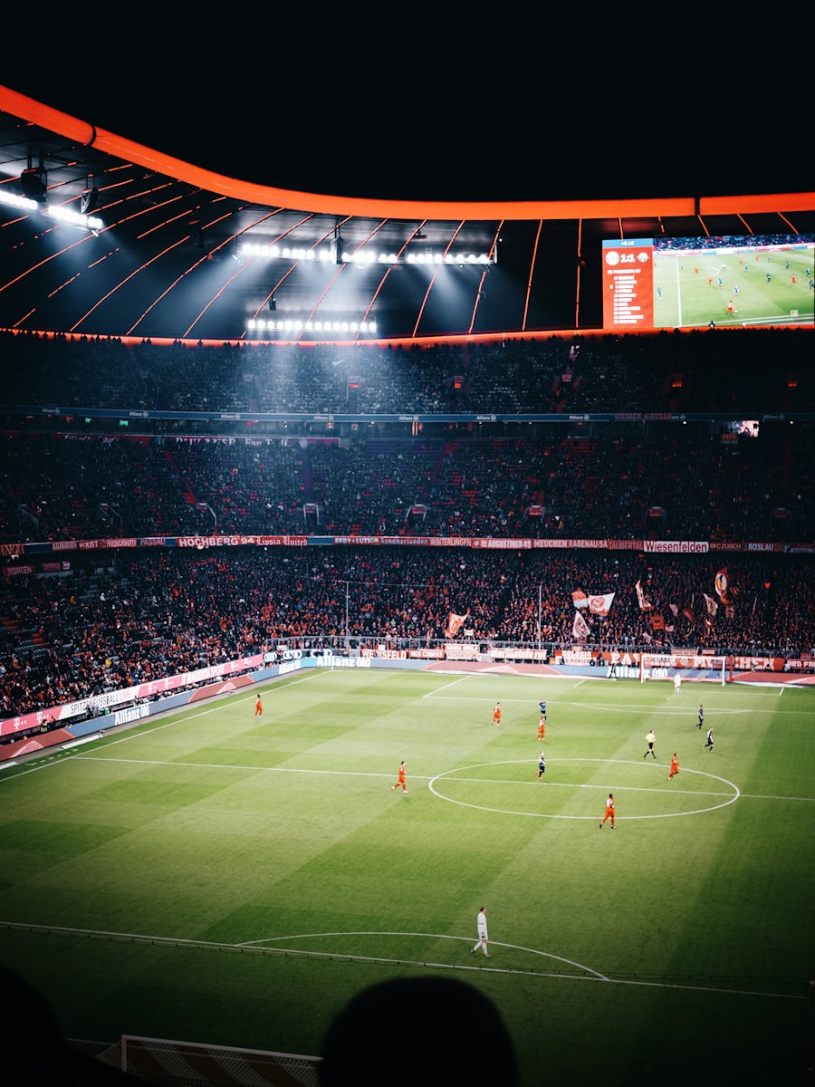 Suporter menonton pertandingan sepak bola di stadion